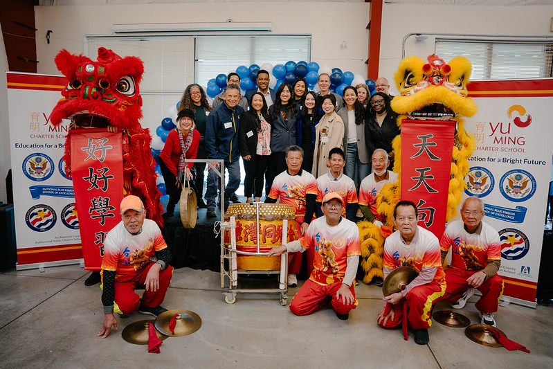 Group photo with lion dancers and officials